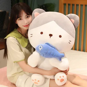 Cute cat plush toy holding fish, soft stuffed animal pillow for kids and girls bedroom.