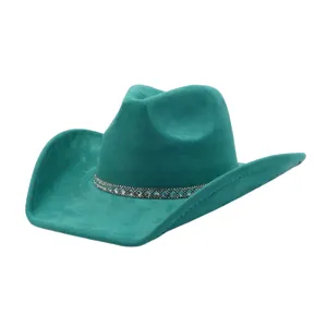Close-up detail of the teal suede cowboy hat showcasing the sparkling rhinestone band and brim.