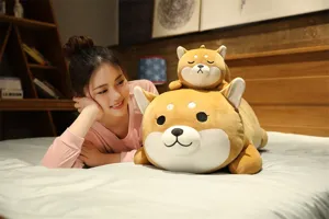 Close-up detail showing a cute sleeping Shiba Inu plush pillow toy on a cozy bed with a model.