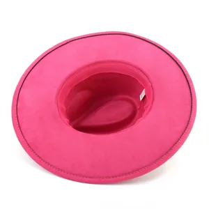 Fuchsia faux suede wide-brim fedora hat detail, showing inner lining and craftsmanship.