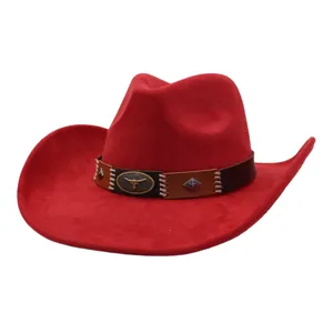 Red suede cowboy hat detail shot showcasing bull skull emblem, decorative band and wide brim.