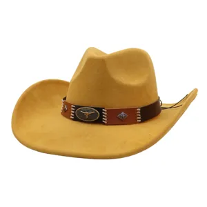 Classic western suede cowboy hat with stylish brown leather band and metal bull skull decor.