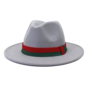 Detail shot of the grey felt fedora hat featuring a classic red and green ribbon band.