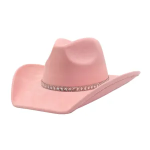 Pink suede cowboy hat with rhinestone band, wide brim jazz hat detail view, fashion headwear.