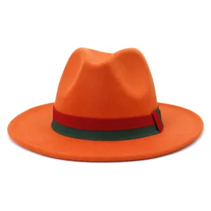 Detailed view of the stylish orange felt fedora hat featuring a classic red and green ribbon band.