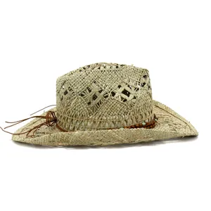 Detailed view of a natural woven straw cowboy hat with beaded leather cord and cut-out pattern.