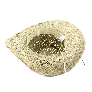Natural straw cowboy hat interior detail showing woven texture and size 57 label.