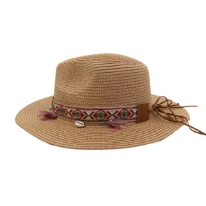 Summer straw fedora beach hat with ethnic woven band and shell tassels for outdoor sun protection.