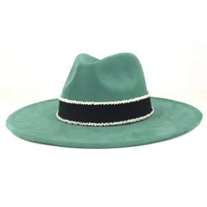 Green suede wide brim fedora hat with chic black band and white bead trim details.