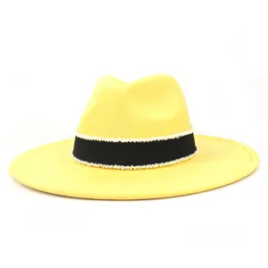 Yellow suede fedora hat for women, designed with black ribbon and delicate white pearl bead trim.