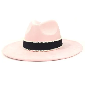 Detail view of the pink suede fedora hat featuring a chic black band with delicate white beads.