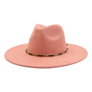 Pink suede wide brim fedora hat with a black and gold chain detail, elegant fashion hat.