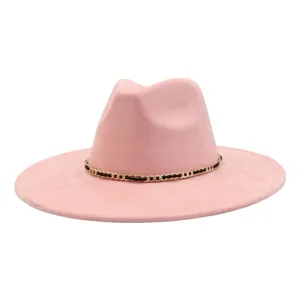 Detailed view of the pink suede wide brim jazz hat with gold chain decoration, stylish.