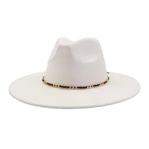 Detailed view of off-white felt fedora hat, featuring a chic black and gold chain band trim.