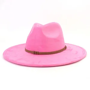 Close-up detail of pink suede fedora hat showing texture and brown braided hat band.
