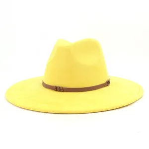 Close-up detail of the yellow faux suede wide brim fedora hat with brown decorative belt.
