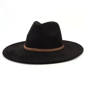 Close-up detail of black suede fedora hat, featuring a stylish brown braided band decoration.