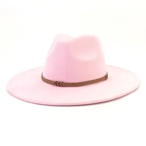 Pink suede fedora hat detail, wide brim design with brown braided belt accent.