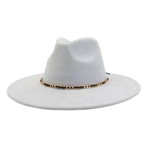 Detailed shot of grey suede fedora hat featuring a stylish gold and black chain accessory.