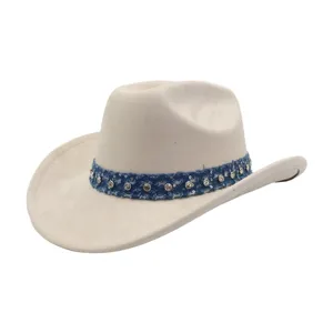 Close-up detail of the denim rhinestone band and suede texture on western cowboy hat.