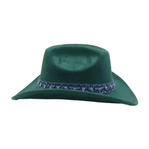 Detailed view of the green suede cowboy hat featuring a sparkling rhinestone denim band.