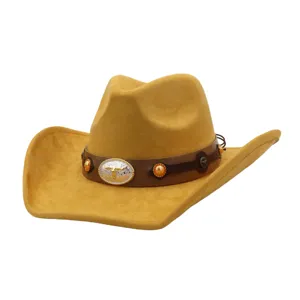 Close-up detail of brown faux suede western cowboy hat with metal bull skull buckle band.