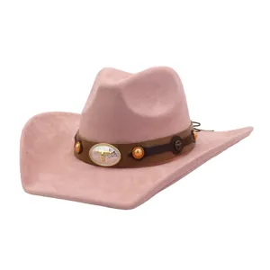 Pink suede cowboy hat with brown leather band and metal bull skull buckle for women fashion.