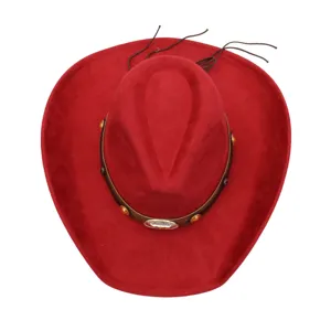 Red suede cowboy hat detail showing soft fabric texture and decorative leather belt.