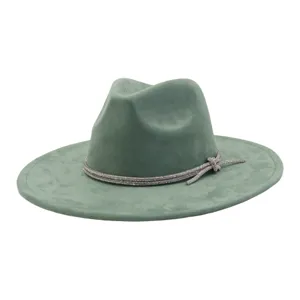 Detail view of green suede fedora hat with sparkling rhinestone band and elegant bow accent.