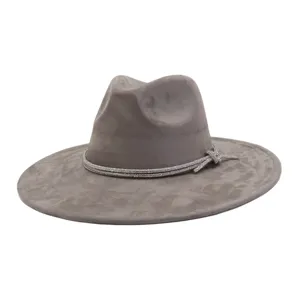 Close-up detail of the grey suede fedora hat featuring a sparkling rhinestone band and bow.