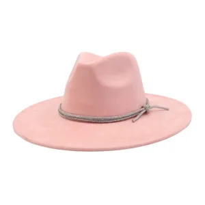 Close-up detail of the pink suede fedora hat featuring a sparkling rhinestone band side bow.