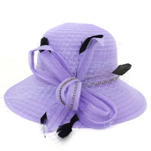 Elegant purple organza sun hat detail, featuring a bow and black feathers decoration.
