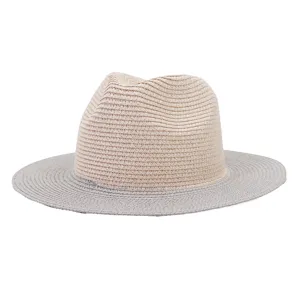 Detailed view of the stylish two-tone straw fedora hat, featuring a beige crown and grey brim.