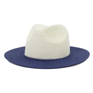 Detailed view of two-tone straw hat, contrasting brim, perfect for summer sun protection.
