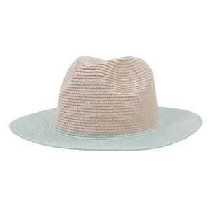 Close-up detail of the two-tone straw fedora hat, showing the woven texture and contrast brim.