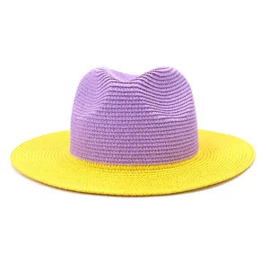 Close-up detail of the stylish purple crown and yellow brim color-block straw hat.