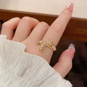 Close-up detail of the elegant bow zircon and pearl ring, showcasing exquisite craftsmanship.