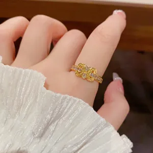 Exquisite gold-plated zirconia open ring with chic interlocking design, elegant luxury style.