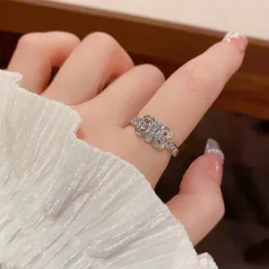 Exquisite sparkling zirconia crystal open ring with unique interlocking design for women jewelry.