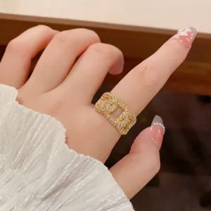 Detail view of the elegant gold zircon chain ring, showcasing sparkling pavé stones and fine craftsmanship.
