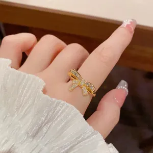 Close-up detail of the elegant gold bow zircon ring, perfect for chic everyday wear showcase.