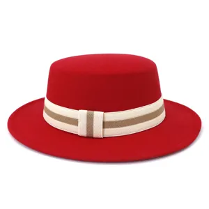 Detailed view of the red wool flat-top fedora hat, featuring a stylish striped ribbon.