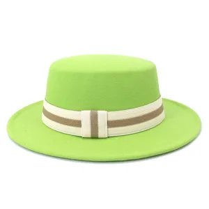 Close-up detail of the vibrant green wool felt flat-top hat with striped ribbon band.