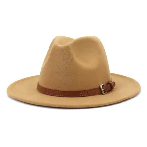 Detail shot of a classic camel felt fedora hat featuring a stylish brown leather strap buckle.