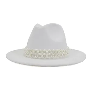Detail shot of white wool fedora jazz hat featuring elegant multi-layered pearl decorative band.
