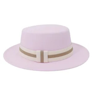 Close-up detail of the pink wool flat-top fedora hat with elegant striped ribbon band.