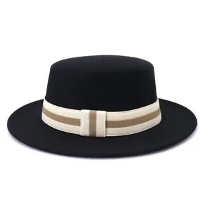 Detailed view of black wool flat top hat featuring an elegant striped elastic band.