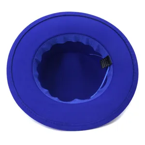 Royal blue wide-brim fedora hat inner lining detail showing fabric composition label clearly.