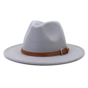 Close-up detail of the grey felt fedora hat, showing the brown leather belt and metal buckle.