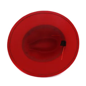Classic red wool felt fedora hat detail view, elegant wide brim autumn winter fashion headwear.